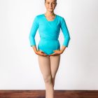 girl in blue ballet leotard and cardigan